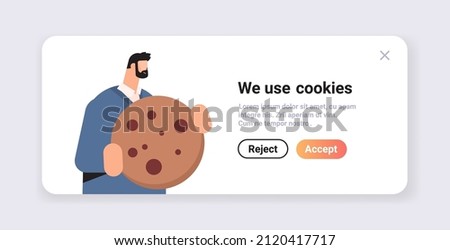 businessman holding cookie protection of personal information internet web pop up we use cookies policy notification