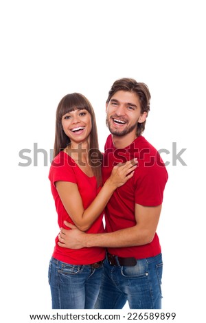 beautiful young happy couple love smiling embracing, man and woman smile looking at camera wear red shirt jeans, isolated over white background