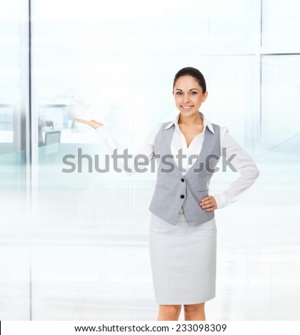 Businesswoman smile show open palm empty copy space, business woman showing pointing side, concept of advertisement product in modern office