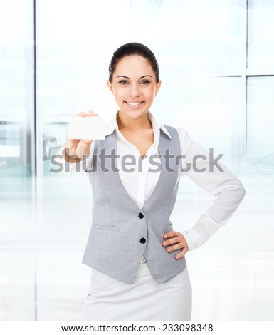 Businesswoman smile hold blank business card, young attractive business woman give visiting, credit card with empty copy space in modern office