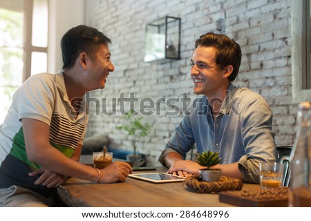Two Men Sitting at Cafe, Asian Mix Race Friends Guys Happy Smile Natural Light