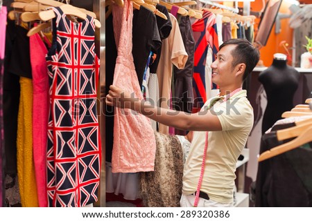 Asian man shopping choosing dress shop tailor fashion clothes designer