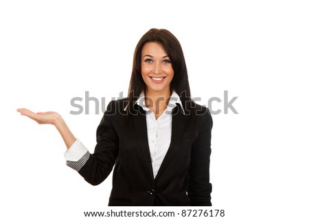 Businesswoman standing smiling holding her hand showing something on the open palm, concept of advertisement product, empty copy space, isolated over white background