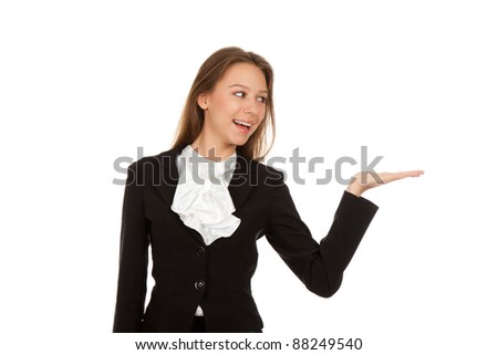 Young businesswoman standing smiling holding her hand showing something on the open palm, concept of advertisement product, empty copy space, isolated over white background