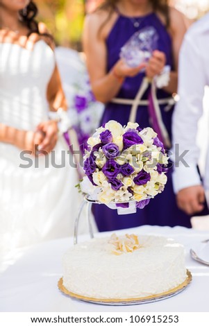 Beautiful wedding exotic bouquet with plumeria and cake