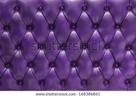 Genuine leather upholstery background for a luxury decoration in purple tones