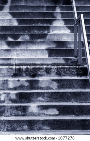 A High Obstacle of Drab Concrete Steps on a Cold Rainy Day (shallow focus, blue tint).