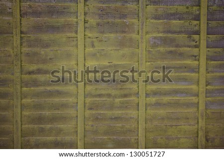 Old weathered wooden fence close up background (texture)