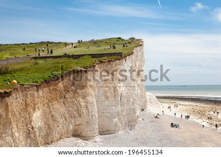 SEVEN SISTERS NATIONAL PARK, ENGLAND - MAY 25. People on the cliffs and the beach in Seven Sisters National Park, East Sussex, England on May 25, 2014