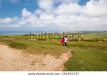 BEACHY HEAD, ENGLAND - MAY 25. People on Beachy head, view of the road and Seven Sisters cliffs, East Sussex, England on May 25, 2014