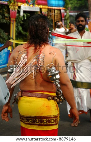People piercing on body during a traditional Indian religious festival.