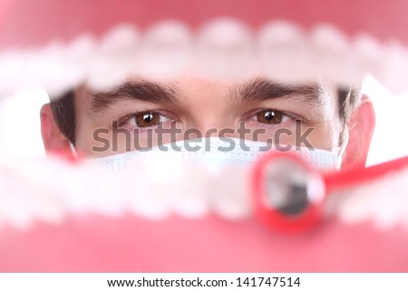 Dentist Working Inside a Patient Mouth