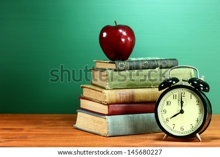 Back to School Books, Apple and Clock on Desk