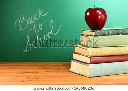 Copy Space Back to School Books and Apple With Chalkboard