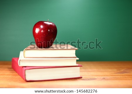 Copy Space Back to School Books and Apple With Chalkboard