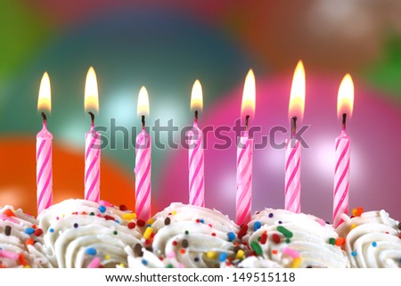 Happy Birthday Celebration with Balloons Candles and Cake