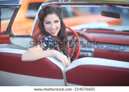 Beautiful Woman Posing and and Around a Vintage Car