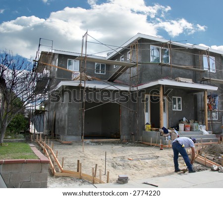Residential Home Under Construction With Workers on the Job