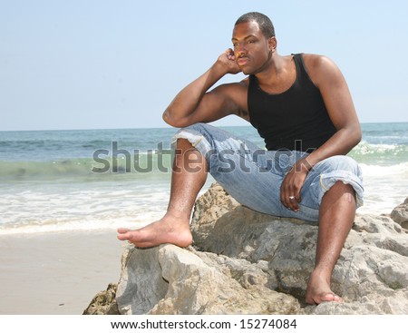 African American Youth in Deep Thought on the Beach