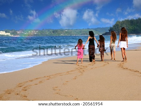 Family on the Beach Looking at a Rainbow on the Ocean