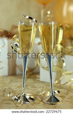 Two Champagne Flutes Leaning Towards One Another Symbolizing Love
