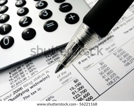 Modern calculator, black pen and tax forms