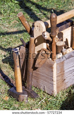 An old tool box containing carpenter\'s tools