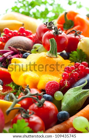 Fresh vegetables,fruits and berries on the white background