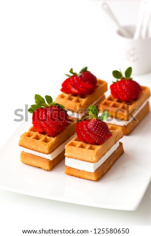 belgian waffles with fresh strawberries and cream