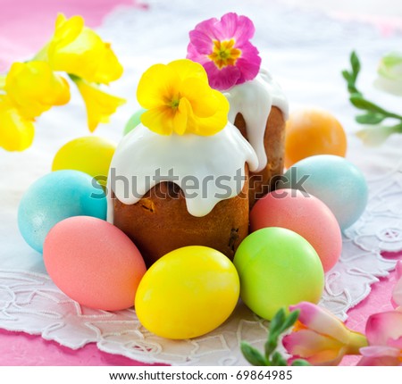Easter cake with glace icing and colored easter eggs