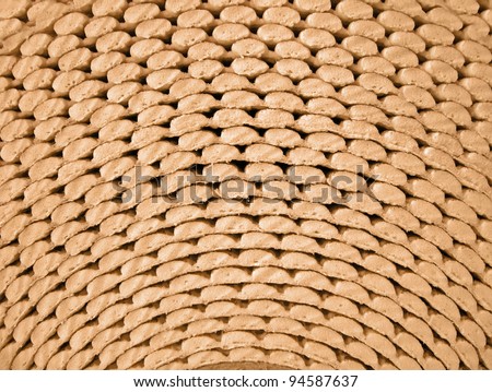 abstract golden roll surface, industrial porous material closeup