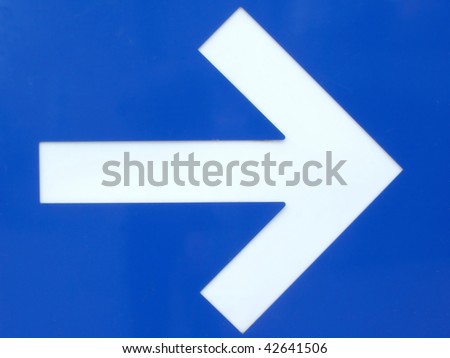 White arrow, on blue metallic background, showing direction.