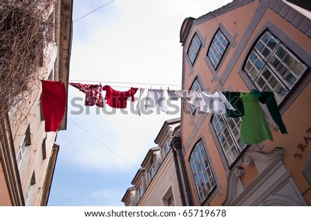 Clothesline with drying colorful clothes.