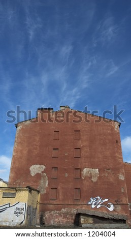 old red house over blue sky