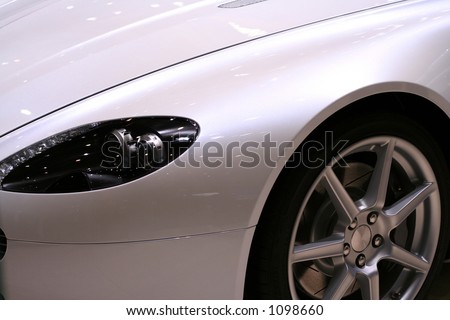 White metallic sports car - Wheel and front head lamps