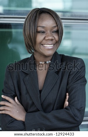 African american woman standing in an office environment.