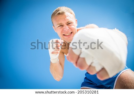 Angry guy hit bandaged fist