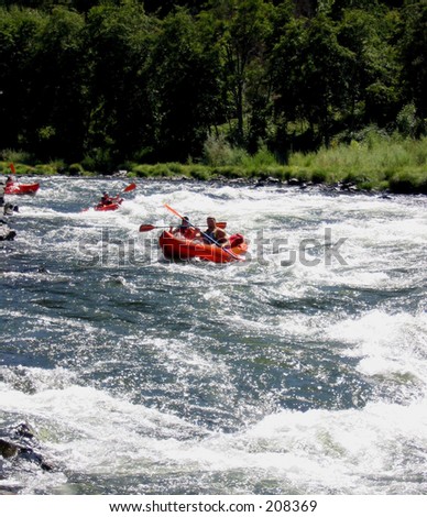 Soft-Adventure on the Rogue River, Southern Oregon\
Image of people paddling inflatable kayaks through rapids on the Wild and Scenic Rogue River in Galice, Oregon.