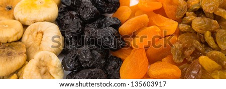 prunes, figs, dried apricots isolated on white background