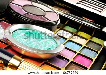 Lot of decorative colorful makeup sets , close up shot