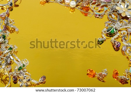 Jewelry from white gold,  isolated on gold background