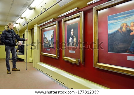 MOSCOW,RUSSIA - FEBRUARY 20:Aquarelle Train is wheeled picture gallery.15 paintings of Sergey Andriyaka and 30 pictures of his students are represented in Aquarelle Train.Moscow Metro,February 20,2014
