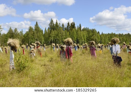 SUOMUSSALMI, FINLAND - JULY 26, 2012:Silent people is work of art by artist Reijo Kela. This work include about thousand scarecrow. Silent People moved to their present home in autumn of 1994.