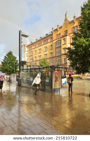 TAMPERE, FINLAND - AUGUST 28, 2014:Heavy rain and sun on streets. Tampere is most populous inland city in any of Nordic countries.It was founded as market place on banks of Tammerkoski channel in 1775