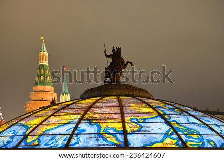 MOSCOW, RUSSIA - DEC 6, 2014:Fountain Clock World is dome of underground shopping mall. On top of glass cupola is monument to Saint George Victorious and Dragon, whose author is sculptor Tsereteli