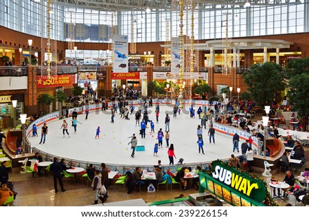 MOSCOW, RUSSIA - DECEMBER 21, 2014: Ice skating rink at shopping center MEGA Khimki offers wonderful ice, wardrobe, nice music and a lot of cozy cafes next to rink