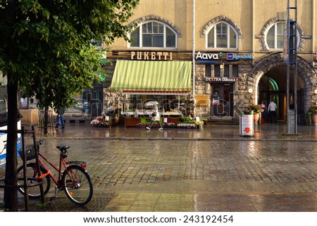TAMPERE, FINLAND - AUGUST 28, 2014:Heavy rain and sun on streets. Tampere is most populous inland city in any of Nordic countries.It was founded as market place on banks of Tammerkoski channel in 1775