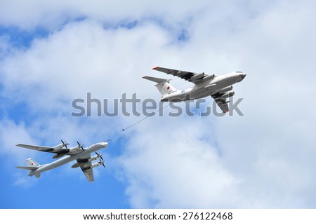 MOSCOW, RUSSIA - MAY 5, 2015:Russian Air Force IL-78M air-to-air refueling tanker demonstrates in-flight refueling of Tu-95MS strategic bomber during rehearsal for Victory Day military parade