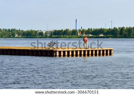 HAPARANDA, SWEDEN - JULY 11,2015:Torne (Tornio) is river in northern Sweden and Finland. For approximately half of its length it contains border between these two countries. It rises at Lake Torne