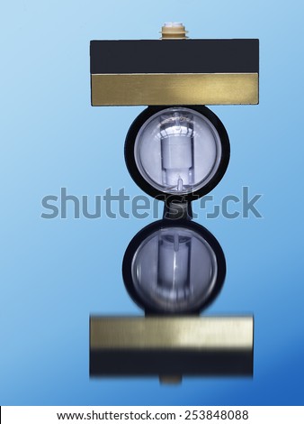 Optical dispenser for beverages on blue background